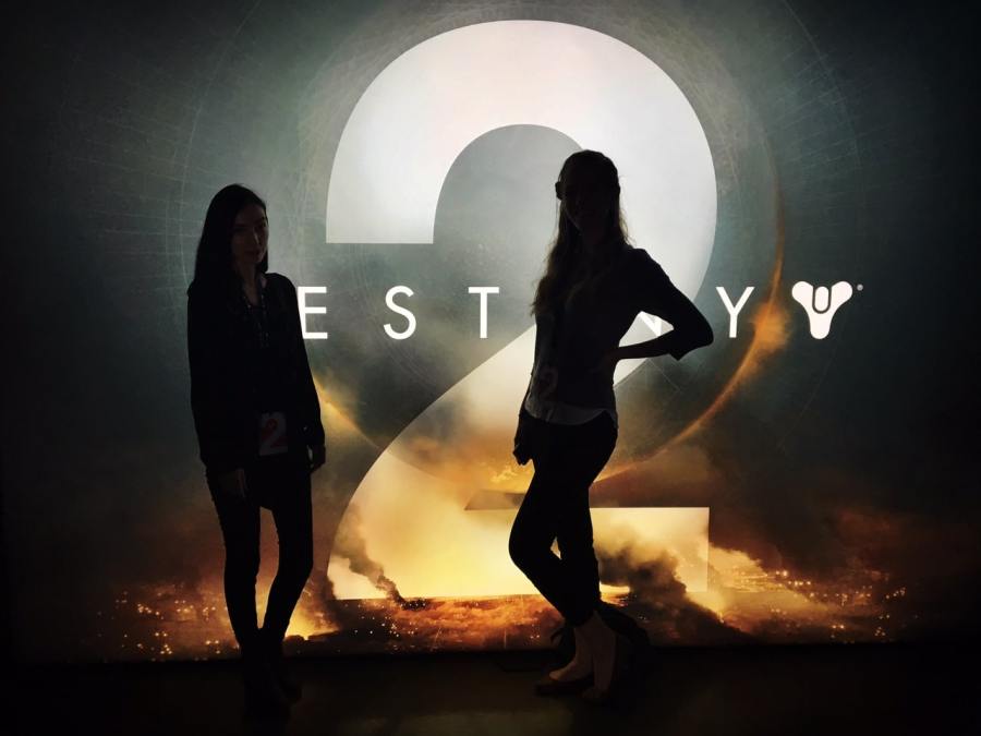 The Sillouettes of two women standing in front of the Destiny 2 logo.