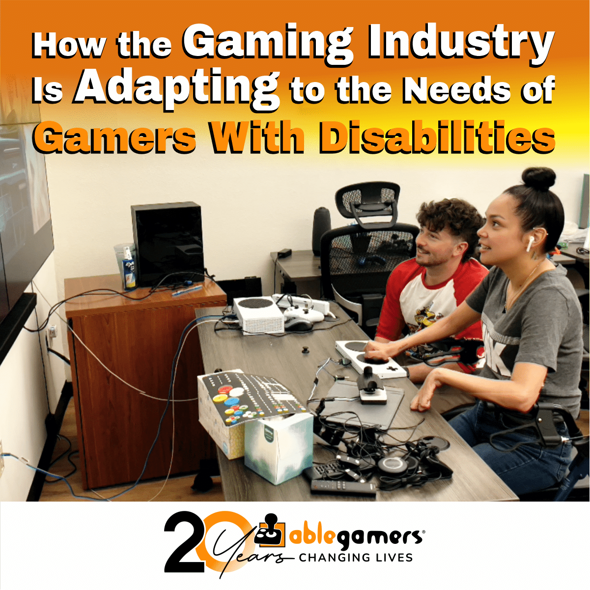 A photo of two people. a young man with dark hair and a mustache and a young woman with dark hair up in a bun playing video games using adaptive gaming controllers and text that says 'How the gaming industry is adapting to the needs of gamers with disabilities'