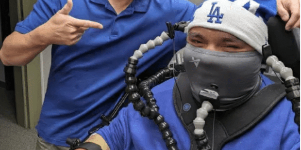 Andy Lin with Mr. R, who is using a custom adapted gaming setup using both 3D printed and commercially available components.