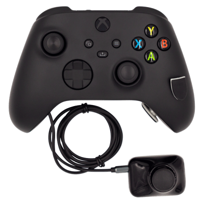 A black Xbox One controller with a small external thumbstick attached by a cord.