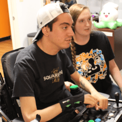 J and p peer counselor helping a young man find the right adaptive controller