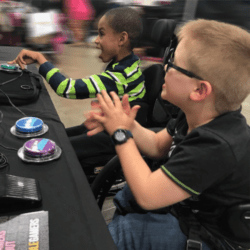 kids Two young boys playing video games together