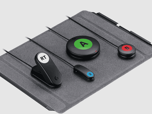  Four switches placed on a gray board. There is a trigger, a small microlight switch, a large button, and a small button. They are labeled RT, X, A, and B respectively.