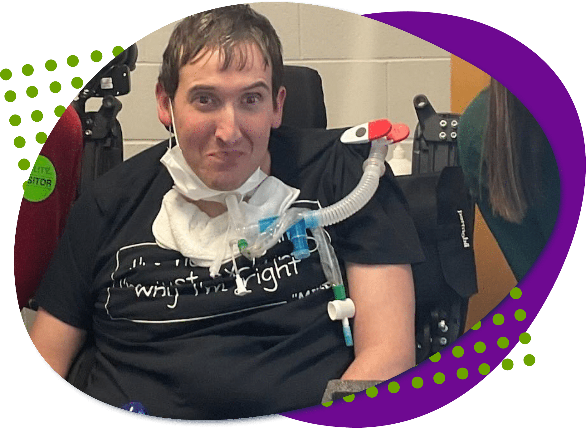 Michael stack White male in a wheelchair wearing a black shirt.