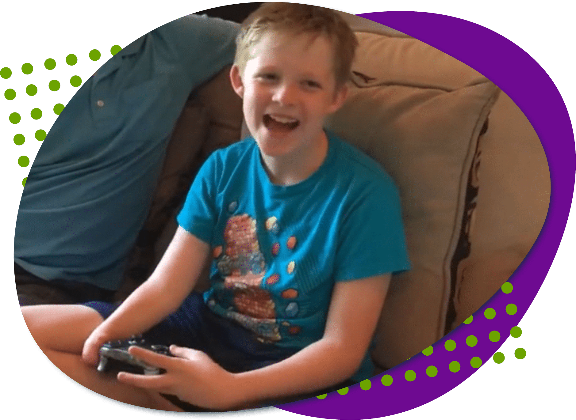Thad, a young man wearing a blue shirt holding a controller in his hands.